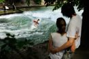 Since the seventies when river surfing was invented in Munich surfers ride the Eisbach static wave.