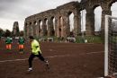 Soccer field near the Aqua Claudia aqueduct in the queducts parc in Rome, January 2015.