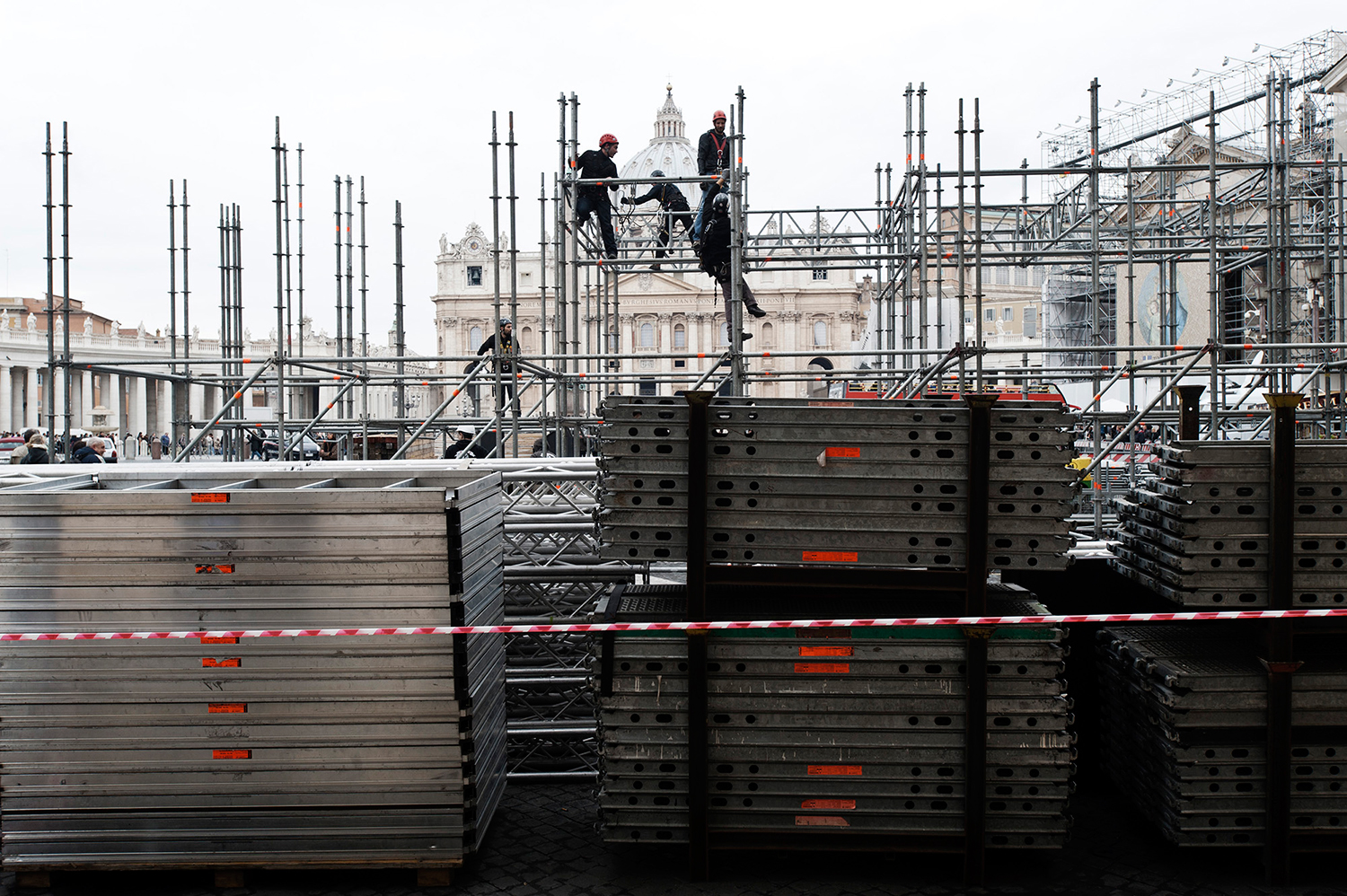 Construction of the scaffolding for the TV and Radio crews on piazza Pio XII just across the road of St Peter's Square.